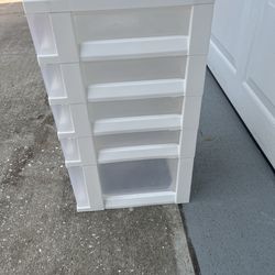 5-drawer plastic dresser: 4 smaller drawers and one larger one. It works very well.