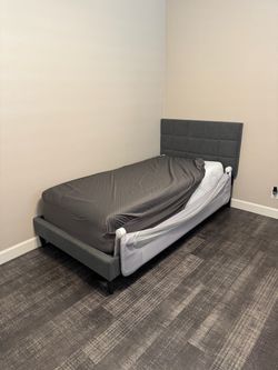 Twin bed with memory foam mattress and foldable rail