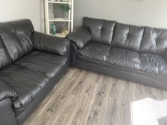 Black couch and loveseat
