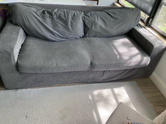 Tan Couch with Gray Slip Cover