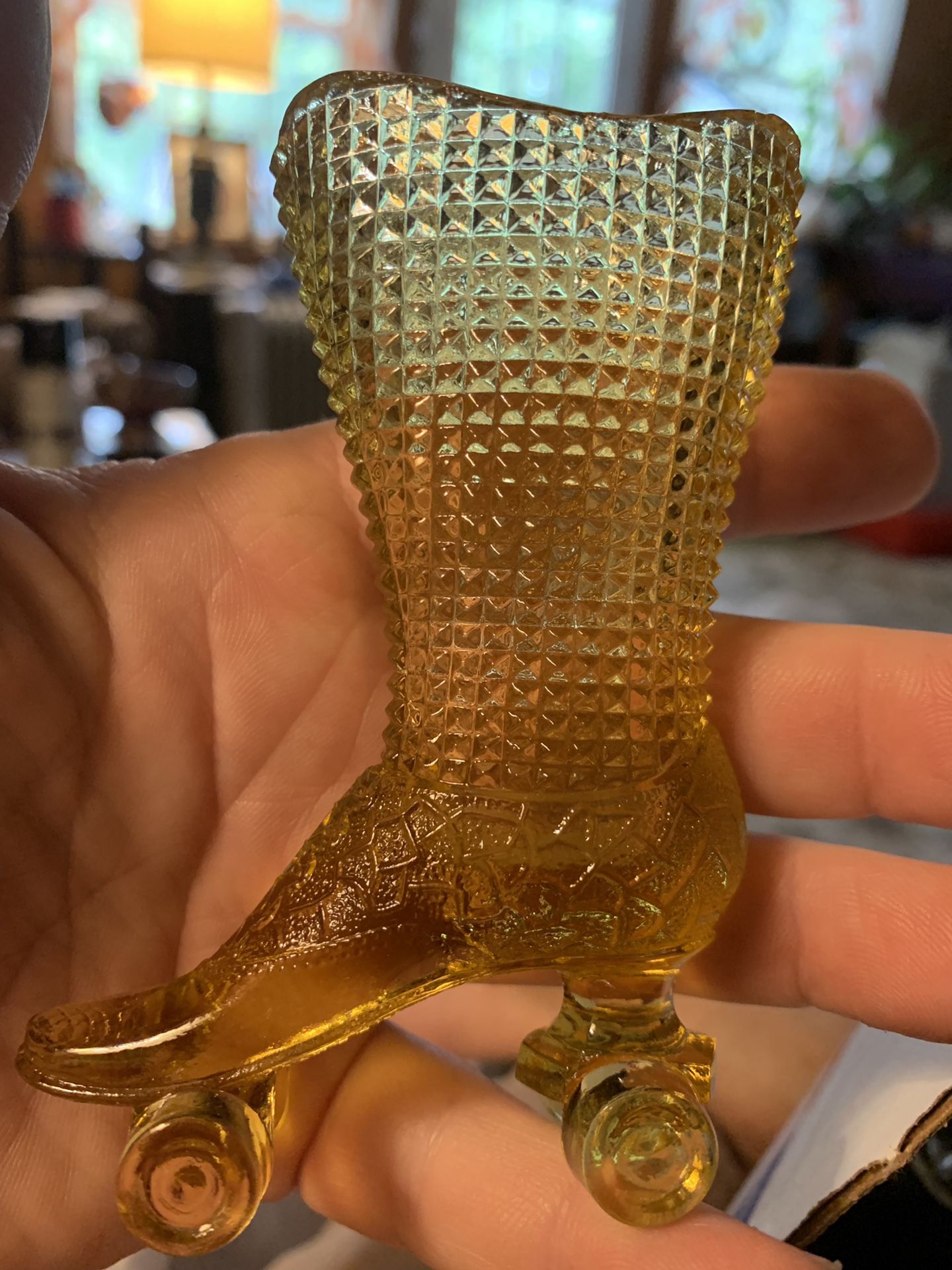 Antique amber glass roller skate boot