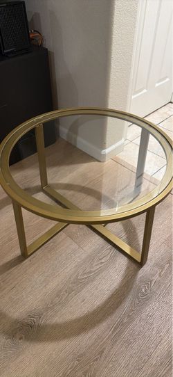 Glass coffee table with gold