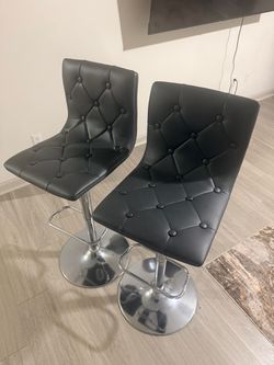 2 grey barstools