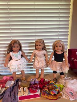 3 American Girl Dolls with extra clothes and shoes