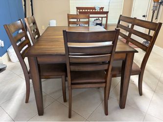 Dark Wood Expandable dining table with 4 chairs and a bench - $285 OBO