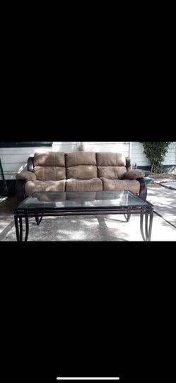 Recliner couch and coffee table and throwing in a recliner chair