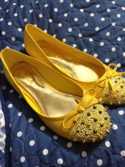 Ladies 6.5 yellow spike flat shoes