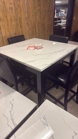 36 inch high table and 424 inch stools for $600 brand new