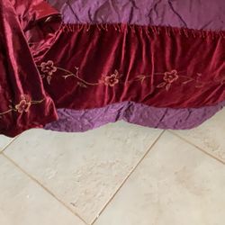 King Size Velvet Bed Spread With Skirt Has Little Flowers  Along The Sides.