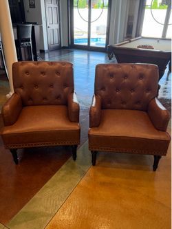 Two Faux Leather chairs