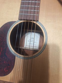 Left-handed Martin DM acoustic guitar