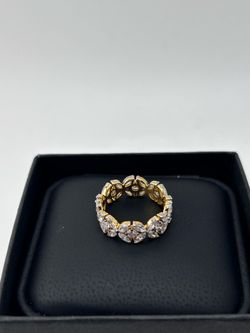 Tiffany style band in 10k Yellow Gold with diamonds
