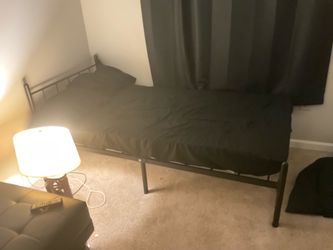 Twin-size bed frame and mattress for sale.