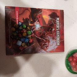 D&D handbook  plus dice 