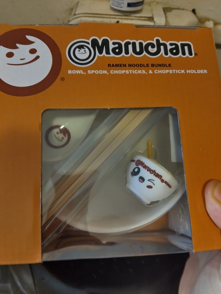 Noodle Bowls With Chopsticks And Spoon
