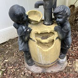 Boy and girl barrel water fountain