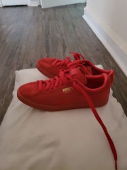 Red puma size 11, black and red puma size 12