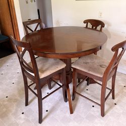 Round Dining Table With Four High Chairs With A Leaf