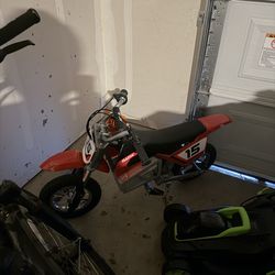 The red one is brand new bought for my son in February but he’s too big for it blue one needs a charger