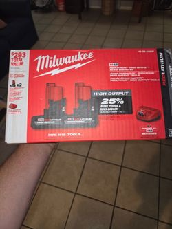 Cargador y dos baterías xc5.0 milwaukee