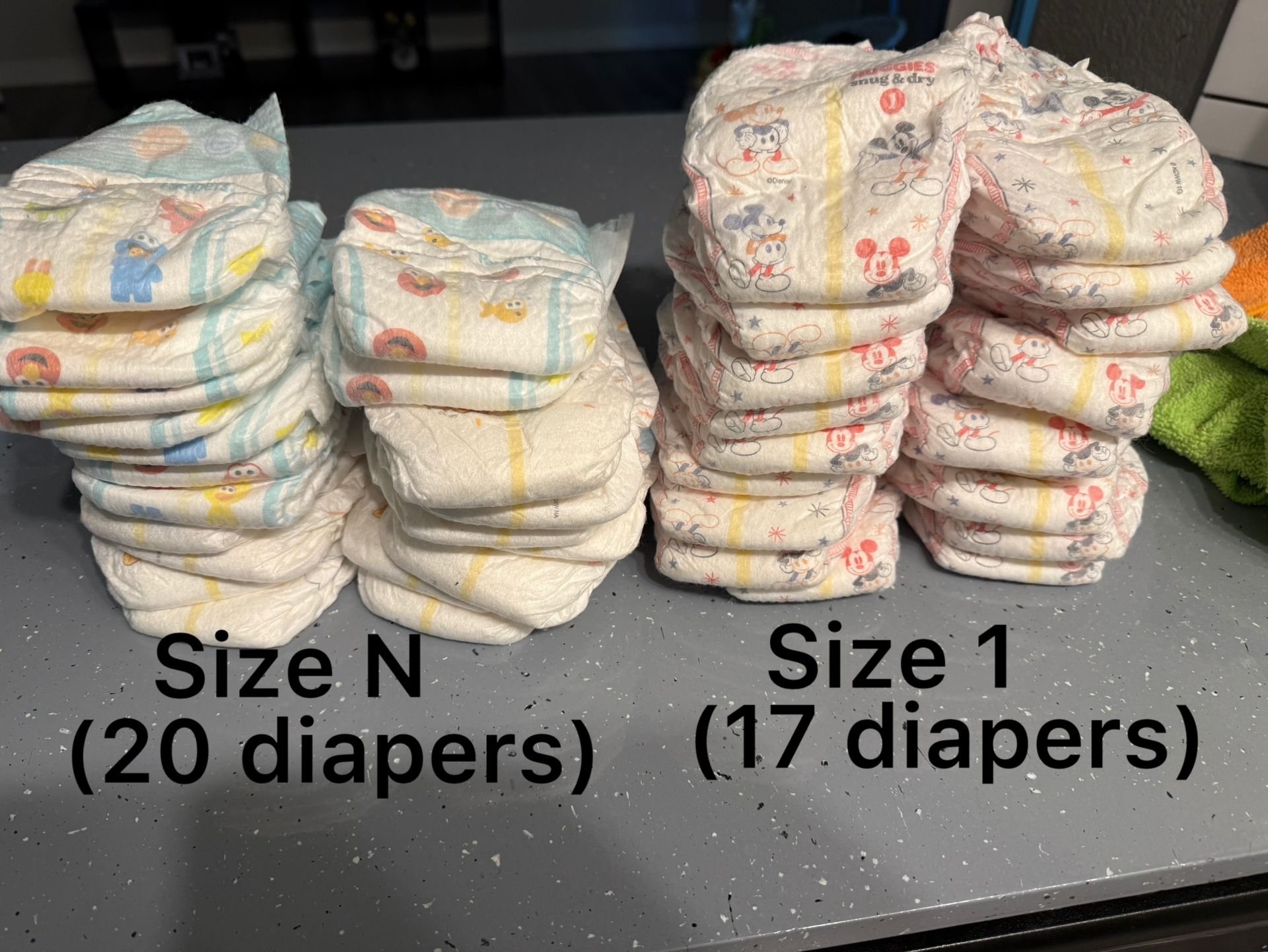 20 Newborn Diapers And 17 Size 1 Diapers 