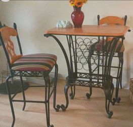 Beautiful tall chairs and table with wine rack