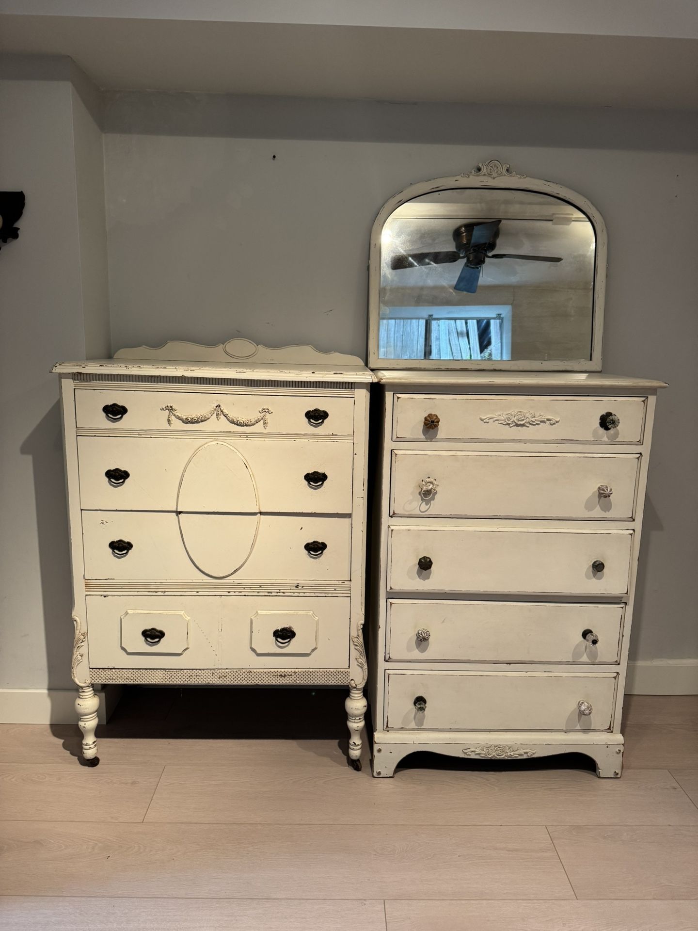 Two antique dressers and one antique mirror