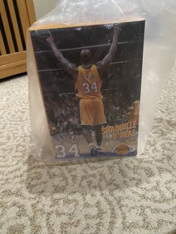 Shaquille O’Neal Statue with game tickets 