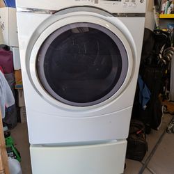 Electric GE  Dryer White w/pedestal. Model# gfd45esskww 7.5 cu ft