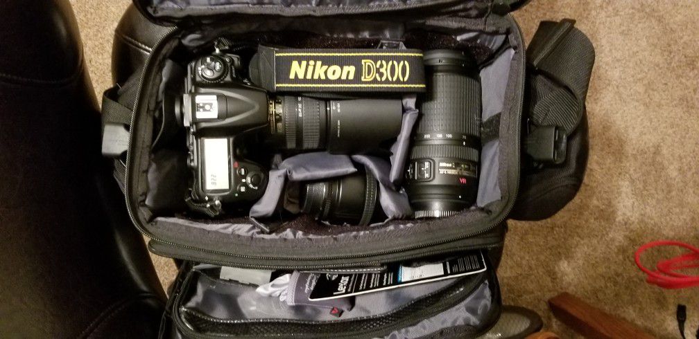 Nikon d300 with 3 nikor lenses, camera case 2 extra batteries and grip with card reader and extra battery