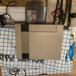 Nintendo with PowerPad and game