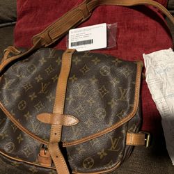 Vintage Louis Vuitton messenger bag. Comes with original receipt and certificate 