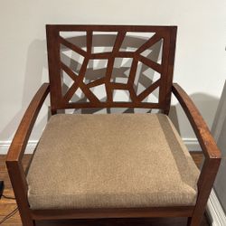 Mid century modern wood cushioned chair with open geometric back
