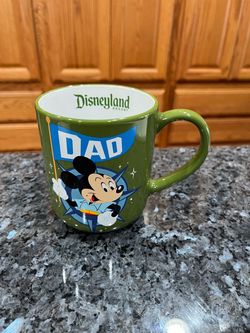 Disney Mickey Mouse Coffee Cup Mug.  The cup says “Dad”.  Capacity 17 ounces.  Nice weight.  Brand New With tags.  Purchased at Disneyland.  Perfect c