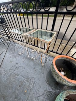 Both vintage wrought iron nesting tables for$50