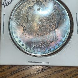 1885 O Rainbow Silver Morgan Dollar