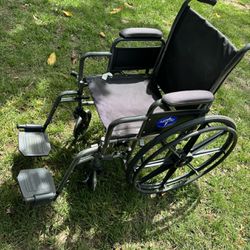 very nice small  kids wheel chair with foot pegs 