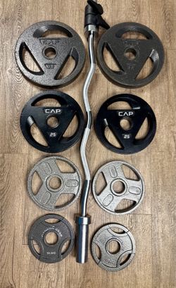 Olympic Curl Bar with Cast Iron Plates Three Grip: 35s, 25s, 10s and 5s. Total: 167 lbs