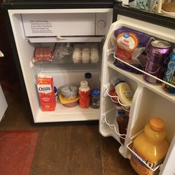 Mini Refrigerator And A Microwave Oven Both For $50. This Is A Firm Price