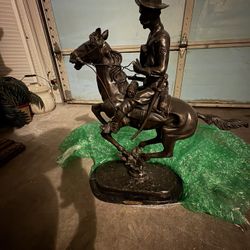 Bronze cowboy on Horse sculature