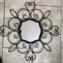 24 in. Wall art decor black metal decorative mirror, new, unique design well made. Black matte metal Brand new never used just doesn’t match my new de