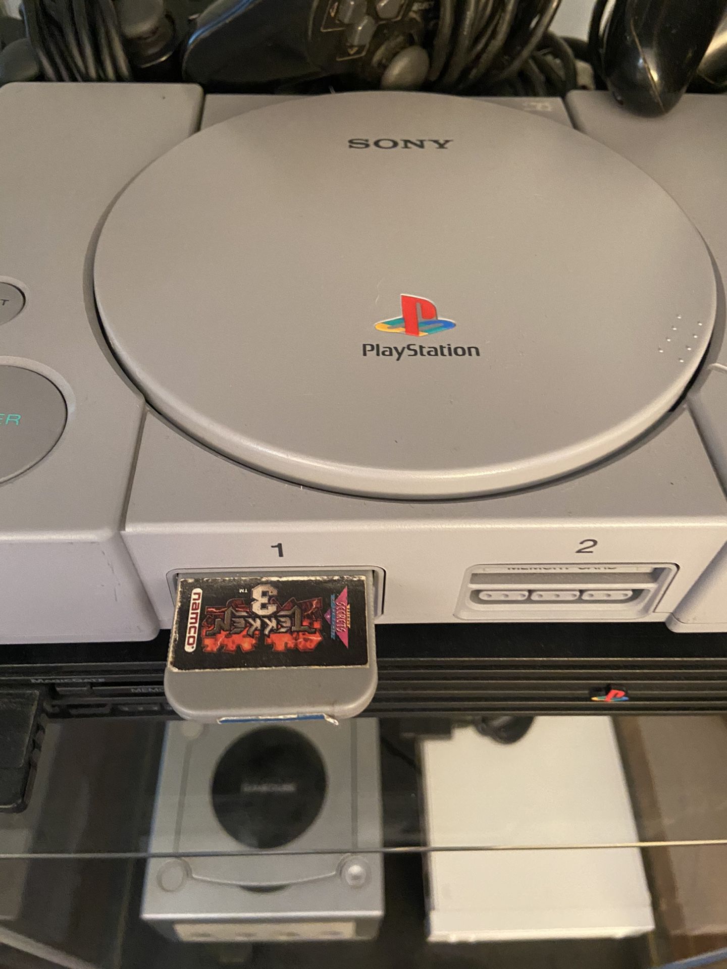PlayStation ps1 with cords and remotes