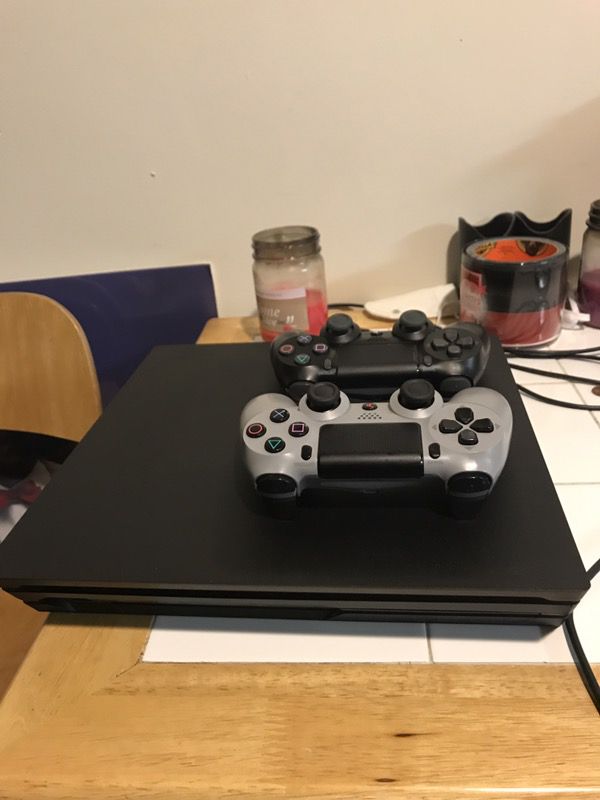 PS4 Pro 1tb System with two controllers and all cords included! And comes with Injustice 2!! Also it has a warranty on it!