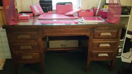 Antique wooden desk with glass top