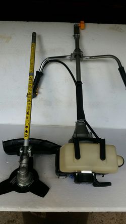 PROFESSIONAL MODEL BRUSH CUTTER, USED A FEW TIMES, LIKE NEW $200. WITH OPTIONAL GRASS TRIMMER