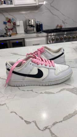 NIKE dunks with pink laces 