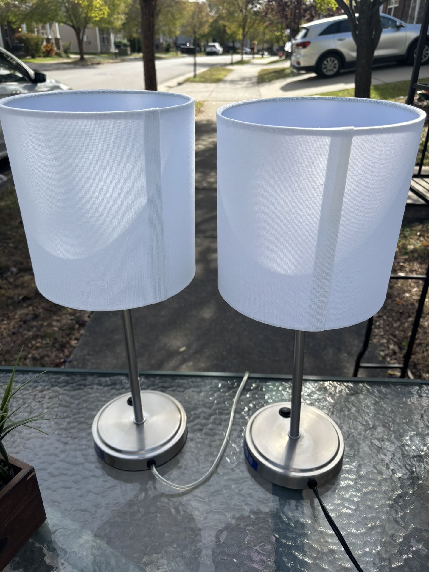 Two Metal Lamps With White Shades
