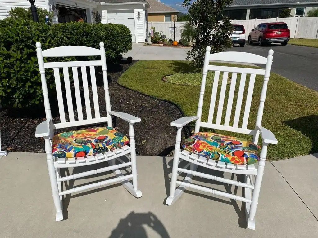 2 Rhode Island white rocking chairs  2 seat cushions  2 covers