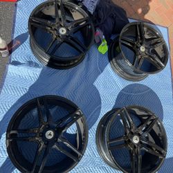 One set of 18 inch rims and two sets of 20 inch rims and tires