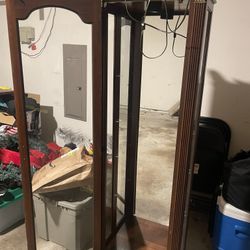 Beautiful traditional tall narrow display cabinet with mirror on the back panel